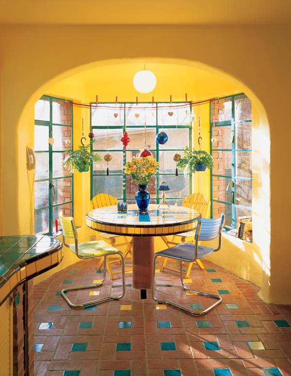 
With many operable windows and plenty of decorative baubles, the kitchen is sunny, breezy and fun.
